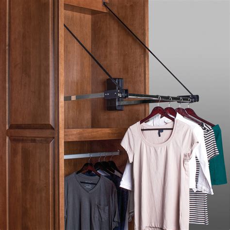These pull down clothes rails are fixed to pivoting arms which when pulled down bring the rails to a more accessible height . . Pull down wardrobe rail hfele